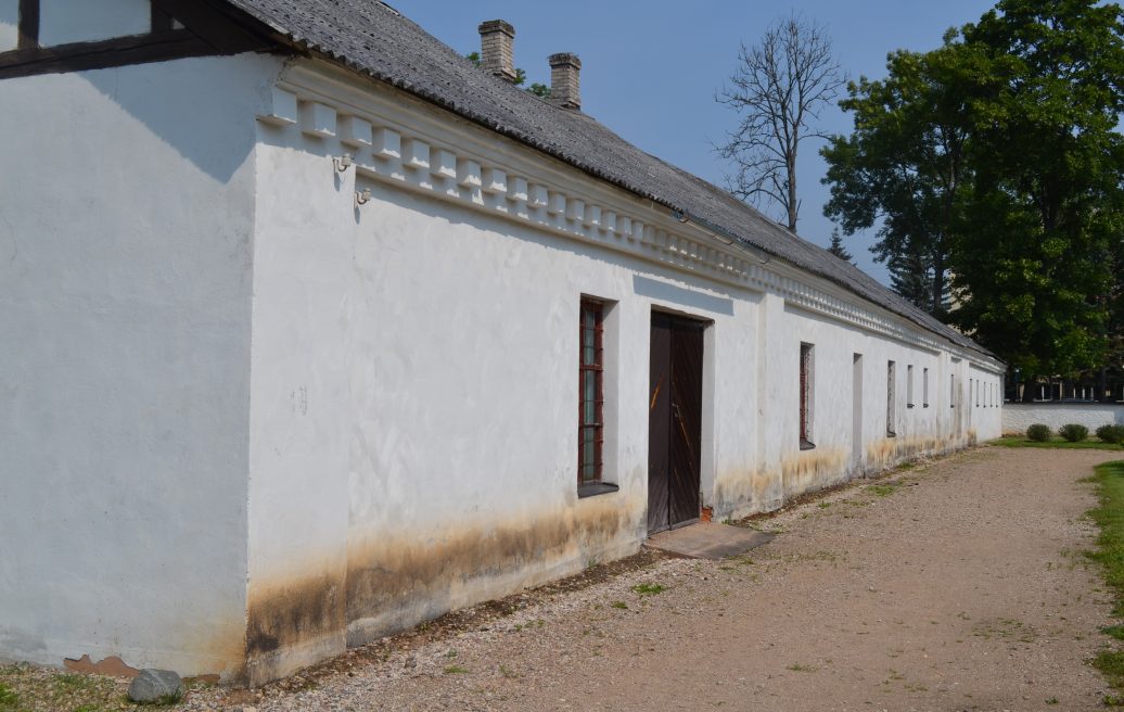 The Crafts House of the Krāslava Castle Complex before restoration with mold on the building decoration