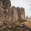 The North tower of the medieval castle of Ergeme from another point of view with racks and a zoomed-in wall