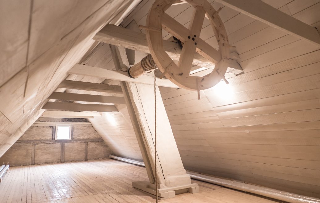 The attic of Mrs. Hoyer’s Hotel in Liepāja with a wheelbarrow visible