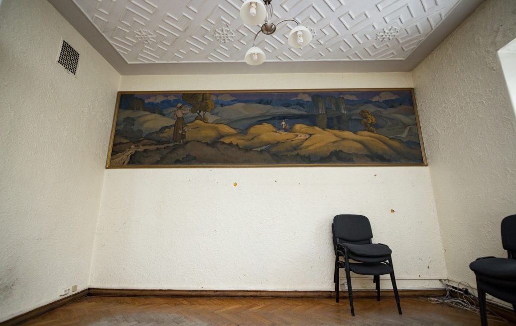 The room of the Sigulda New Palace with artwork on the wall and armchairs