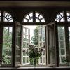 Windows and flowers in vases of Preiļi Manor