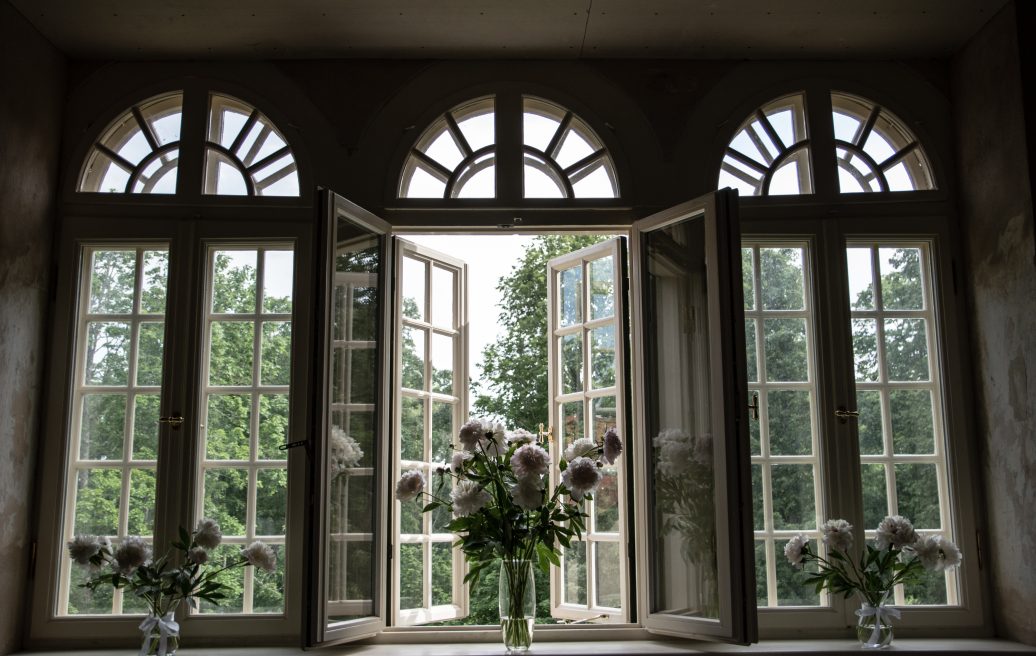 Windows and flowers in vases of Preiļi Manor