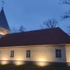 Jūrkalne Roman Catholic Church with lighting at night