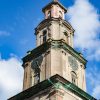 The tower of the Holy Trinity Cathedral of Liepāja before restoration with blue sky and clouds in the background