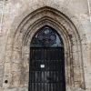 Closed Entrance door of St. John's Church, brown-black color