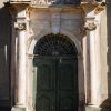 The entrance door of Liepāja's Holy Trinity Cathedral in green color before restoration