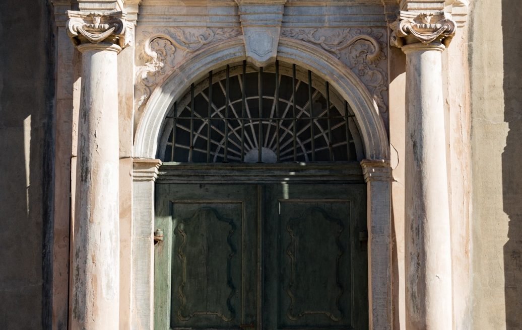 The entrance door of Liepāja's Holy Trinity Cathedral in green color before restoration
