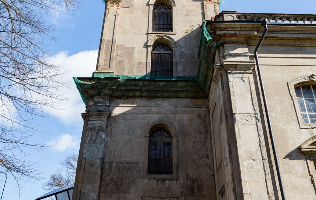 The tower of Liepāja's Holy Trinity Cathedral before restoration with blue sky in the background