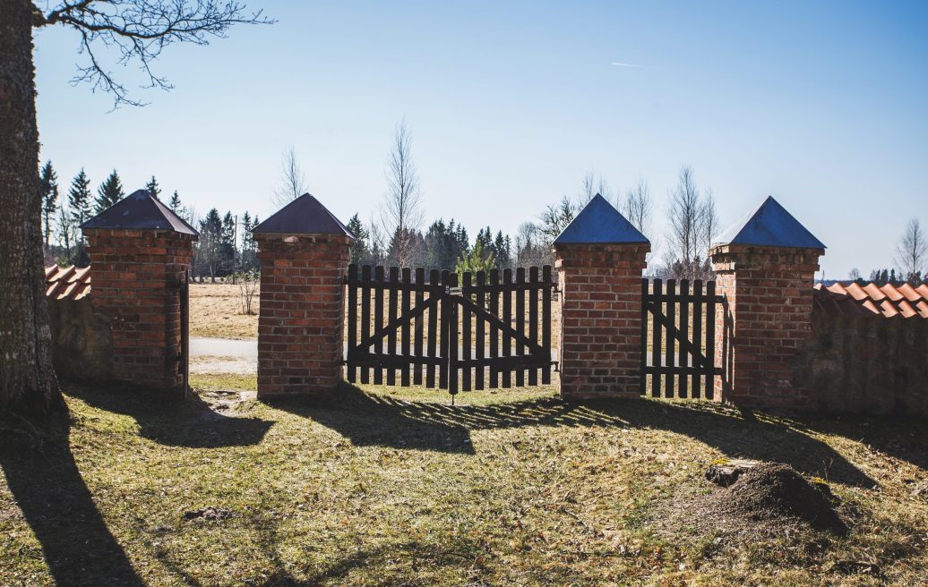 The damaged gate of the Jūrkalne Roman Catholic Church