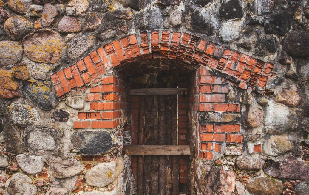 The passage of the southern tower of Alūksne Castle, which is walled up with wooden boards