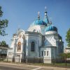Jelgava’s Orthodox Cathedral of St Simeon and St Anna from the outside with a blue sky in the background