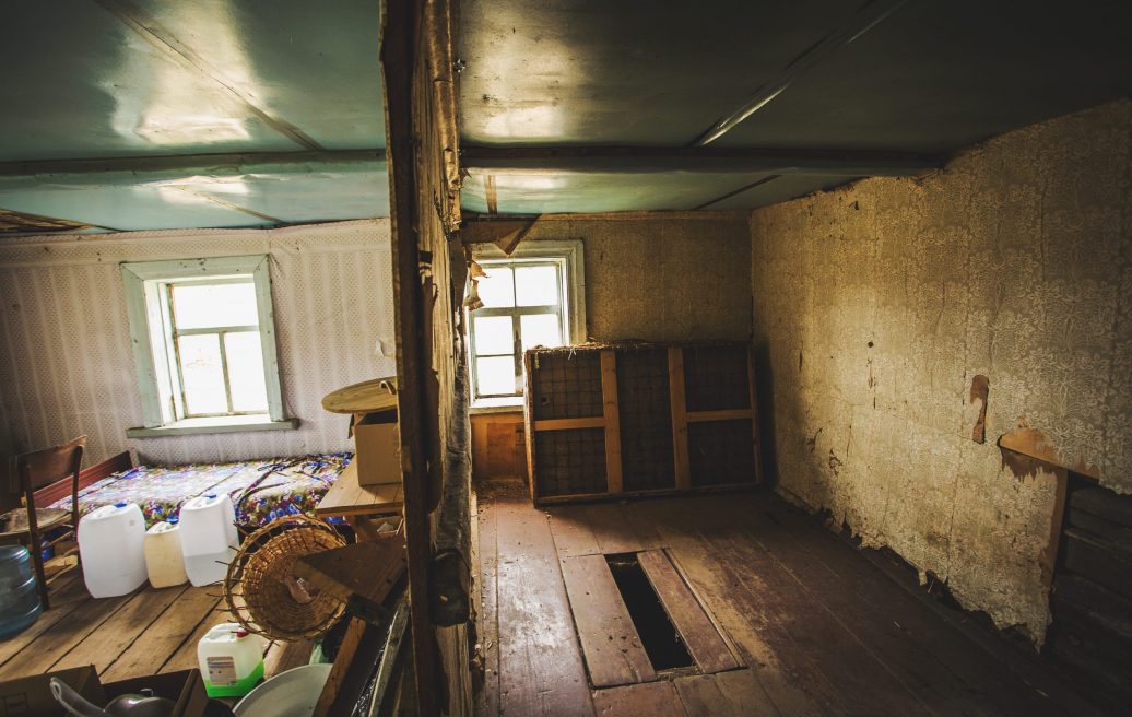 The damaged interior of the Farmstead Slutišķi 2 before reconstruction