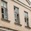 The building of The Kuldīga Needle Factory before renovation with three window close-up