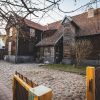 The guest house of Mrs. Hojers before the restoration from the street view, the entrance gate is also visible