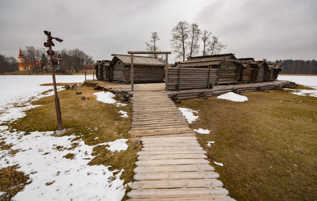 Āraiši Lake Castle Archaeological Park with snow-covered hills