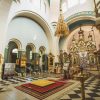 Inside of the Jelgava’s Orthodox Cathedral of St Simeon and St Anna where red, gold and green colors dominate