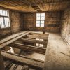 Interior of Mrs. Hoyer's guest house before restoration, floor in process of development