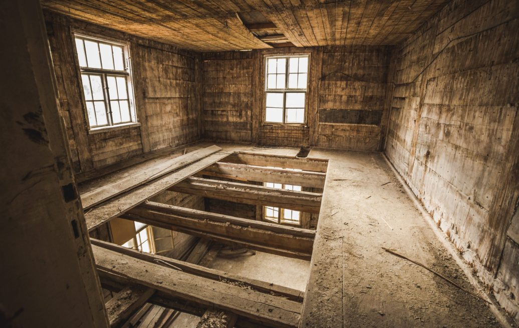 Interior of Mrs. Hoyer's guest house before restoration, floor in process of development