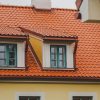 The roof of the Firks-Pedvāle manor building with green window panes