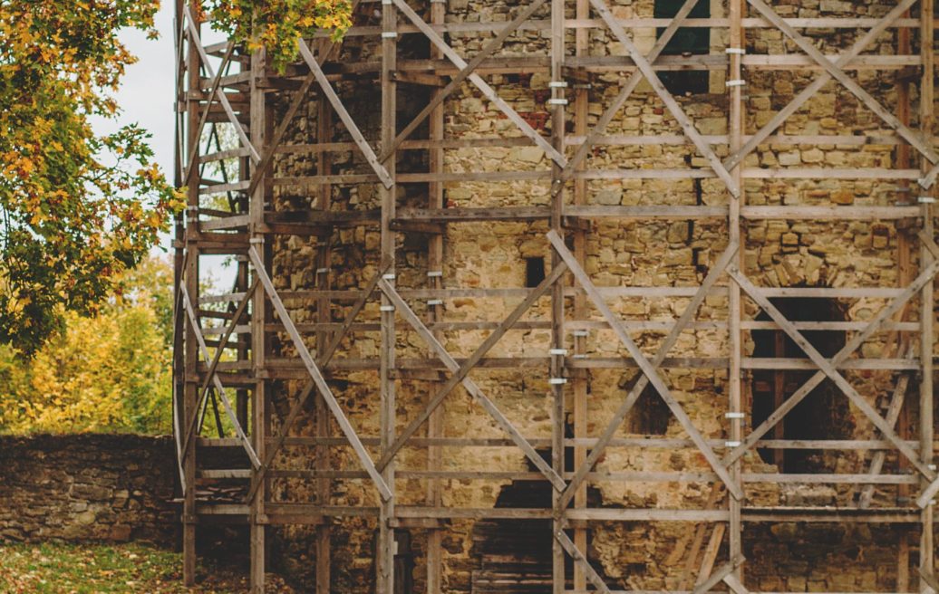 Part of the medieval castle of Cēsis with wooden security racks