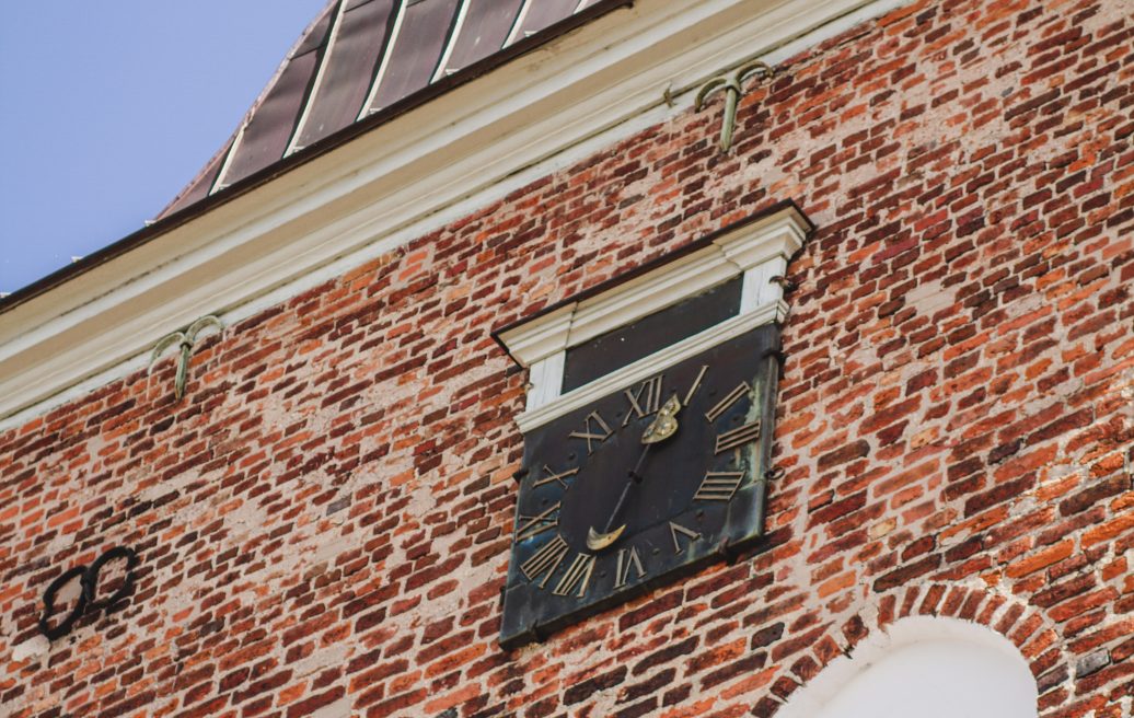 St. Valmiera Simon's Church close up with the church's facade clock