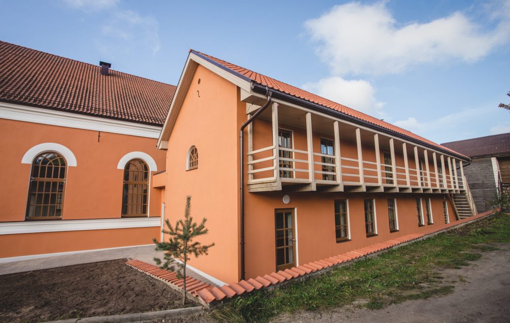 Sabile Makslas Culture and Tourism Center building with blue sky in the background