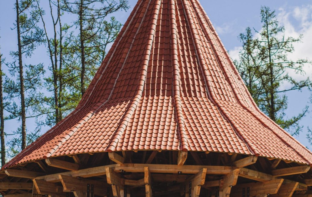 A view of the Northern Tower of Ērģeme Medieval Castle with a restored spire of the tower roof in close-up