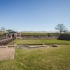 Daugavpils Fortress Engineering Arsenal and bastion escarpment wall in summer landscape