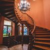 The stairs of Sigulda's New Castle after reconstruction with wooden floors and freshly painted orange walls