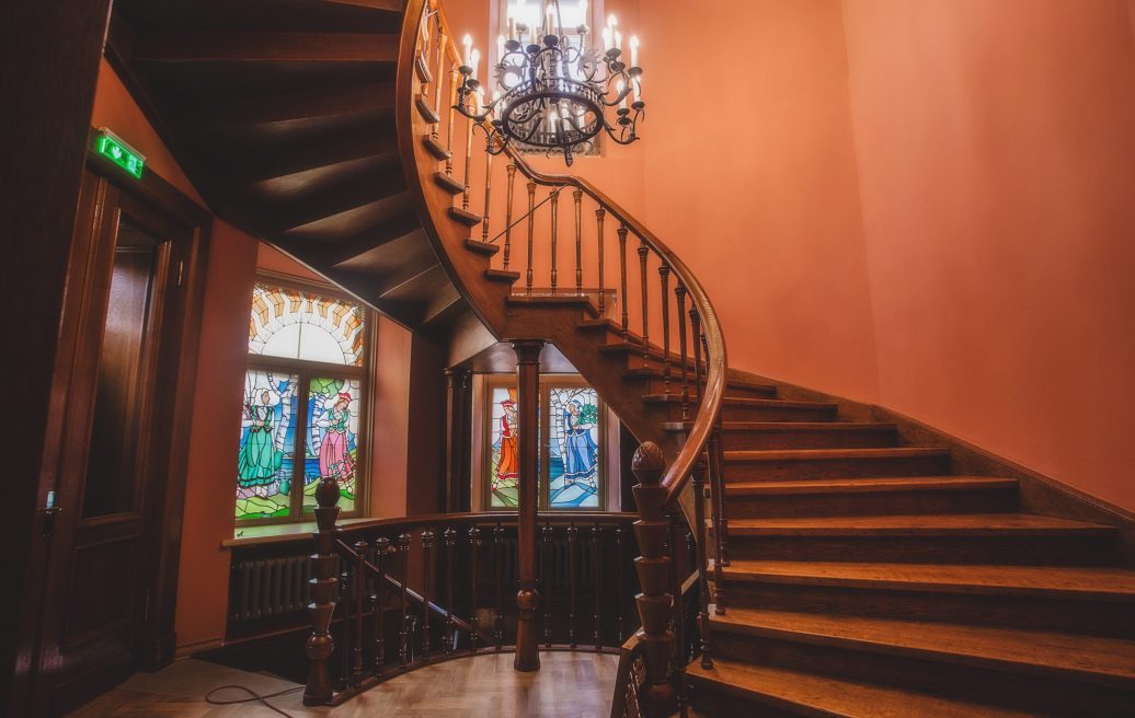 The stairs of Sigulda's New Castle after reconstruction with wooden floors and freshly painted orange walls