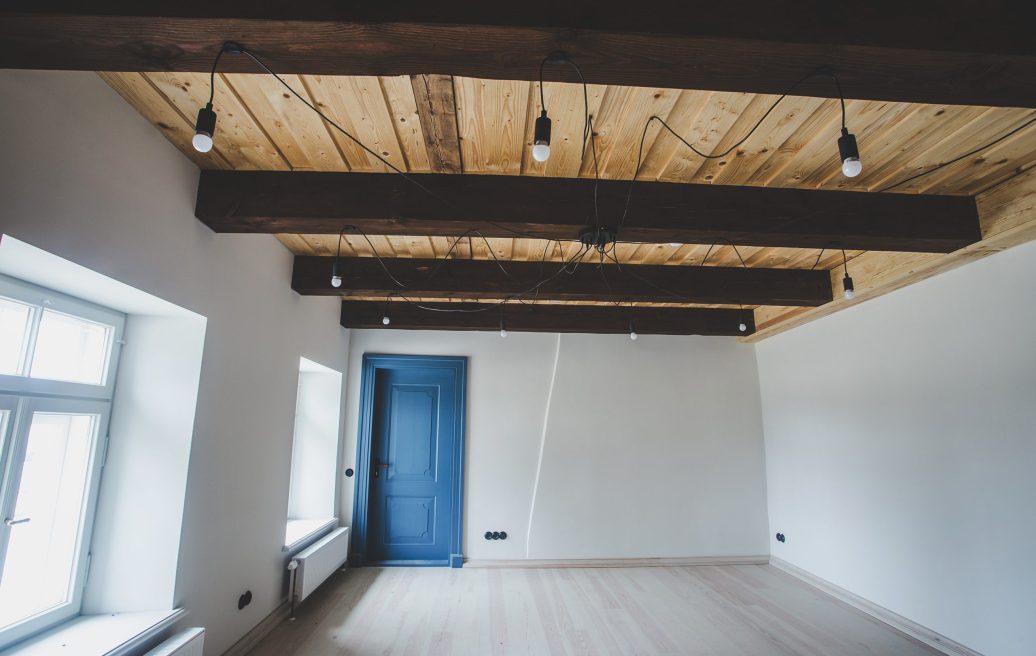 The interior of the Fircks-Pedvāle Manor with white walls and blue doors