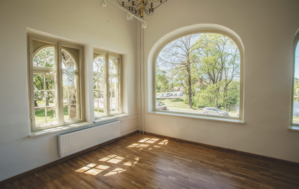 The renovated room of the Dundaga Castle with wide windows that offer a beautiful view of the Latvian summer