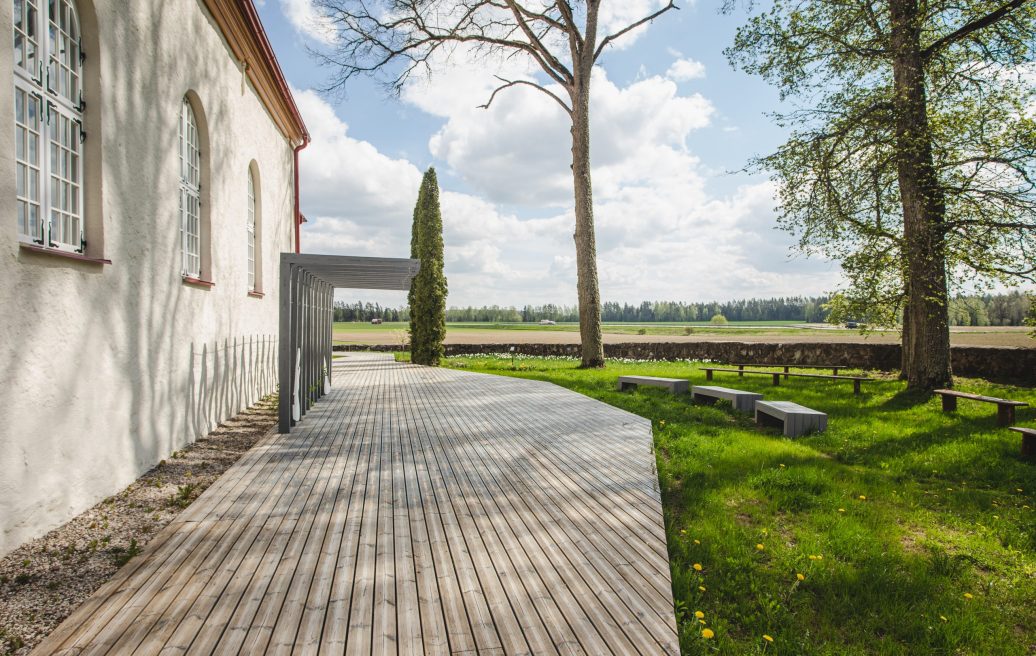 Rubene Evangelical Lutheran Church relaxation area with outdoor benches