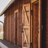 Open door to Alūksne Station Barn