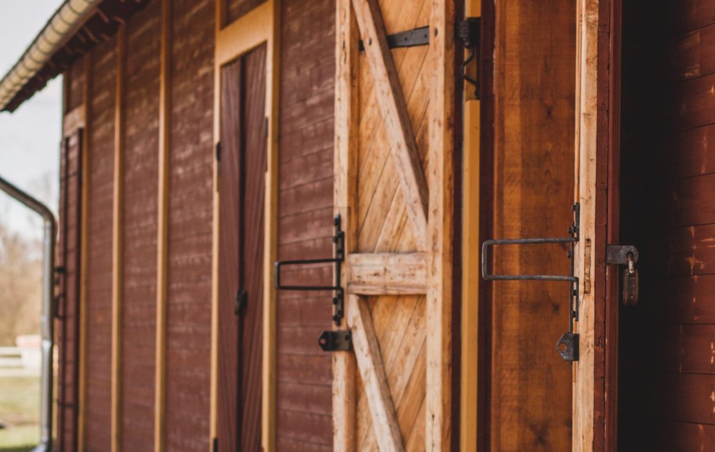 Open door to Alūksne Station Barn