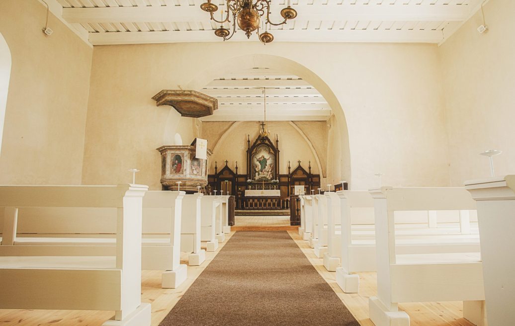 The altar of the Rubene Evangelical Lutheran Church with a painting of Jesus Christ