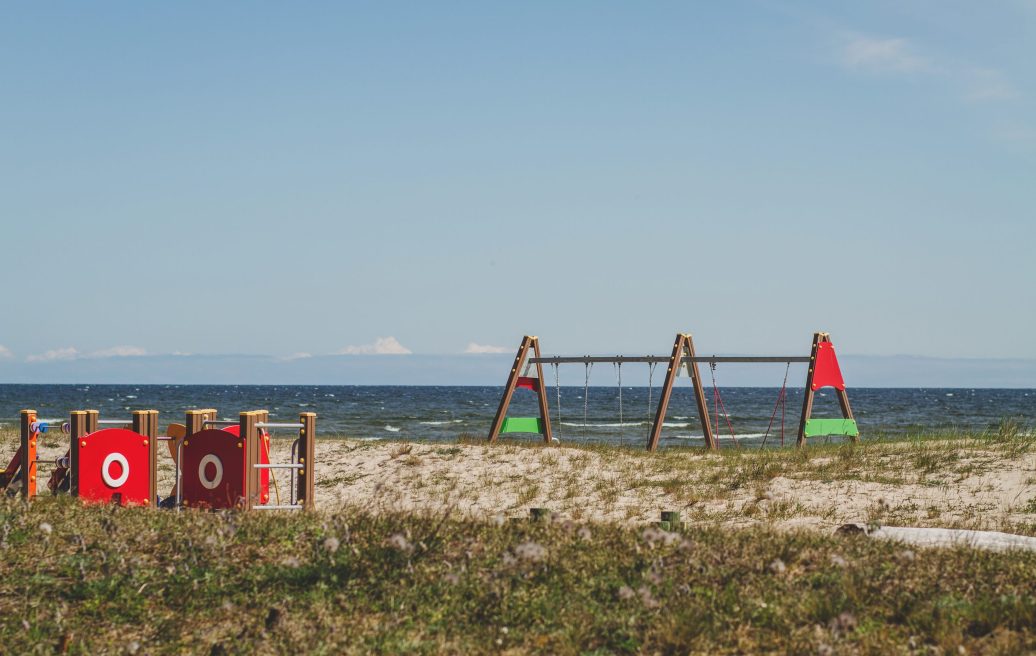 The dune area of Engure Beach. A swing and a children's playground