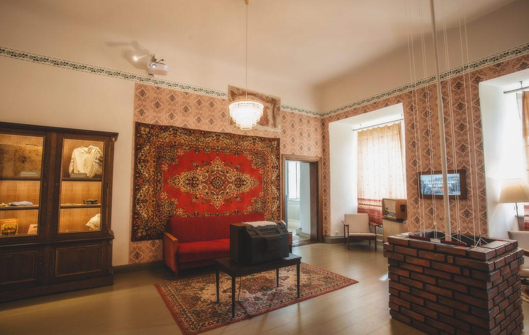 Hall of Krustpils Palace with a luxurious ancient carpet on the wall