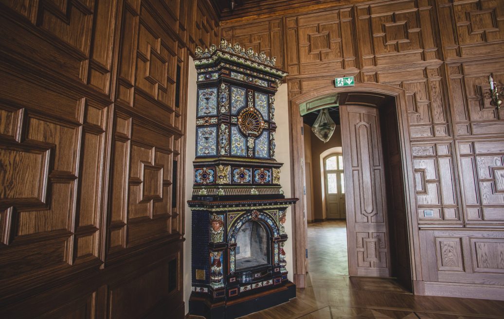 The Krustpils Palace fireplace exhibit is made of fine, luxurious elements and an exit door