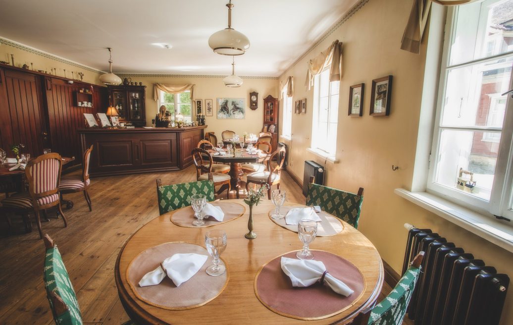 Ungurmuiža restaurant with laid tables waiting for guests