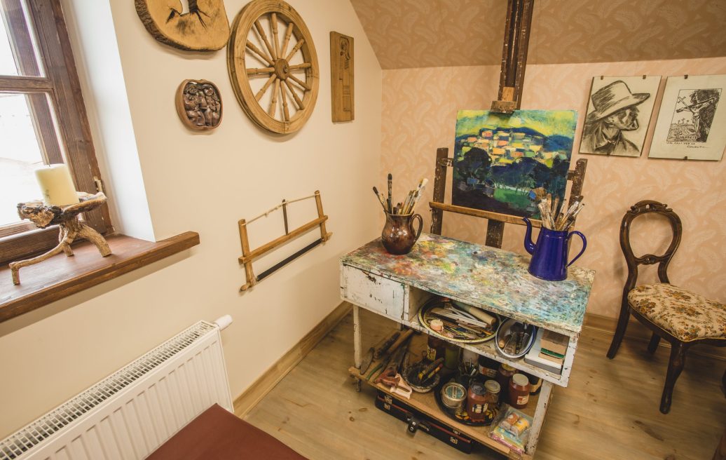 Art corner of the Krāslava Palace complex with brushes and a painting