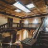 The stairwell of the Stamerien Palace with light shining in from the windows