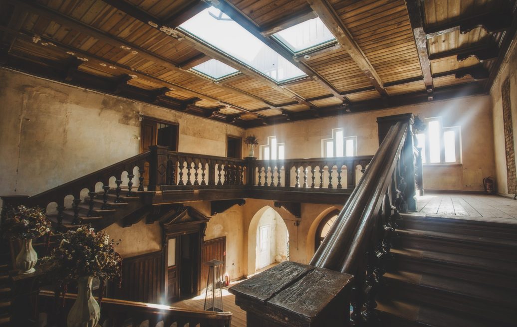 The stairwell of the Stamerien Palace with light shining in from the windows