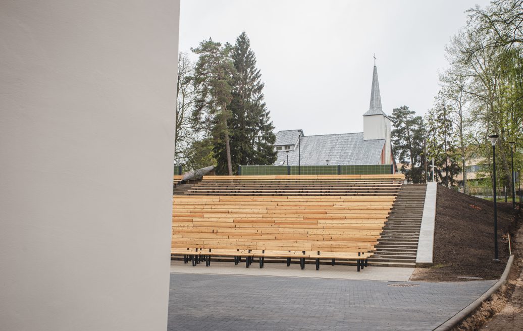 Saulkrasti Neibades park stage seats and a view of the church in the distance