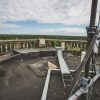 On the roof of the Ķemeru water tower, you can see the horizon with tree tops