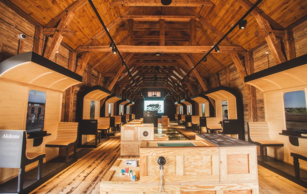 The interior of the Alūksne Station Barn designed as a train cabin