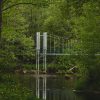 Footbridge over the Irbe river in the landscape