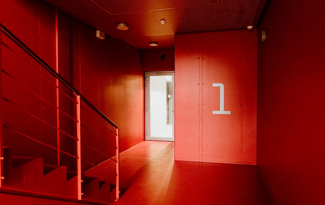The bright red stairwell of the Vizium Science Center