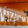 Students jumping in front of the Vizium logo of the Science Center